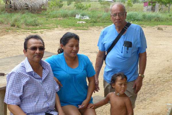 Kumar Mahabir (left), Amerindian Official Gertrude Henrico and Jai Sears at Nappi Settlement in the Rupununi Savannah